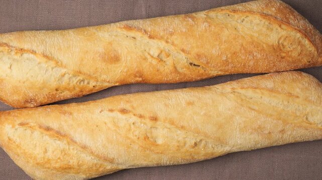 Freshly baked french baguette bread rotating