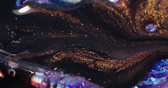 Glitter liquid blur. Dark paint flow. Black stream with golden sparkling particles lava spill on rainbow colorful abstract background.