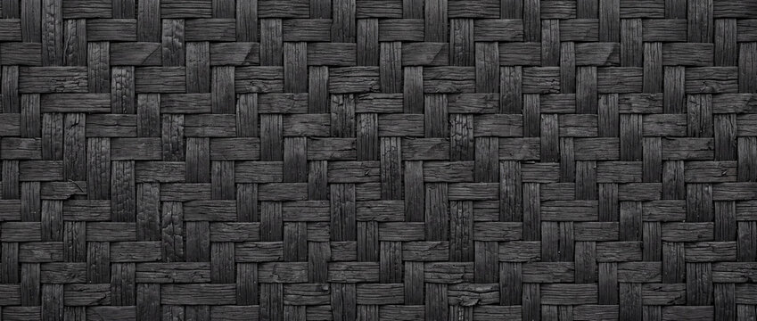 Dark woven wood texture background with intricate basket weave pattern; black handcrafted natural surface for rustic design and textile concepts