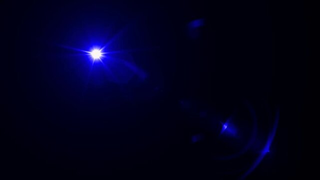 abstract light rays emanating from a center light source over a starry ,optical lens flare shine light animation on black background. Explosion lights optical flare transition, light moving 