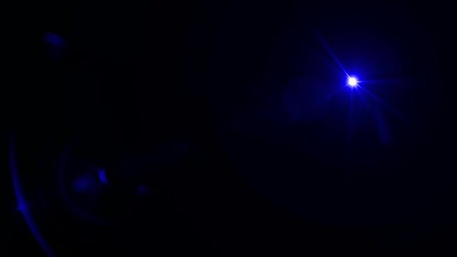abstract light rays emanating from a center light source over a starry ,optical lens flare shine light animation on black background. Explosion lights optical flare transition, light moving 