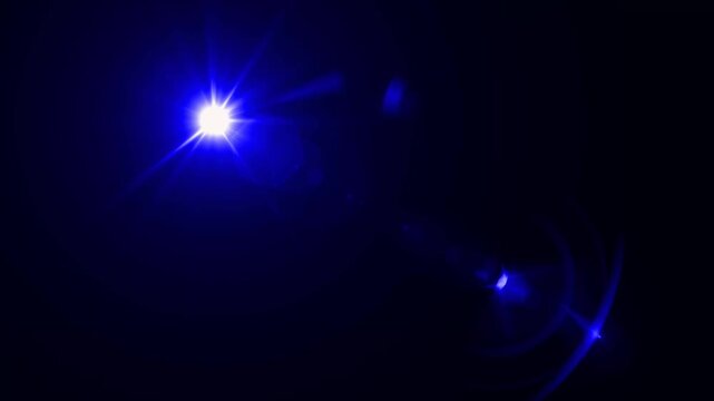 abstract light rays emanating from a center light source over a starry ,optical lens flare shine light animation on black background. Explosion lights optical flare transition, light moving 