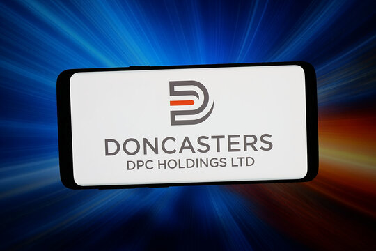 Stuttgart, Germany - 07-17-2026: In this photo illustration, the logo of British company DPC Holdings plc (Doncasters) is displayed on a smartphone in front of abstract background on computer screen.