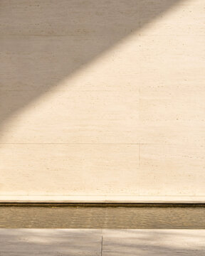 Soft Diagonal Sunlight on a Warm Textured Wall
