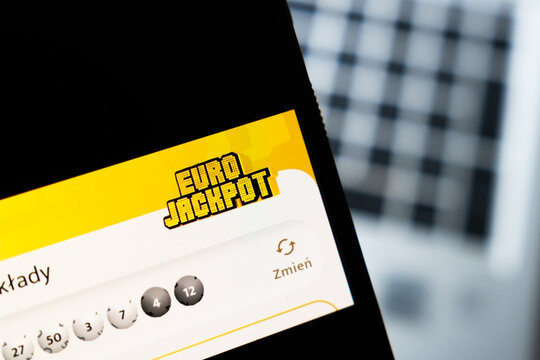 Warsaw, Poland - July 26, 2026: Eurojackpot lottery app displayed on smartphone screen showing numbered balls and ticket interface with yellow branded logo