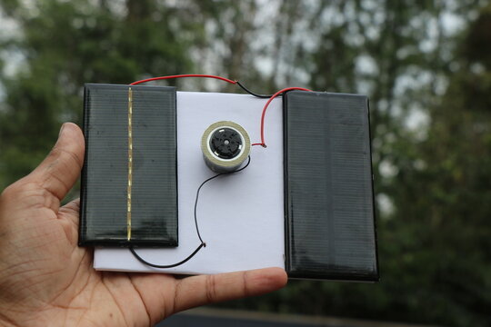 Solar panels connected to dc motor that shows the concept of harnessing solar energy