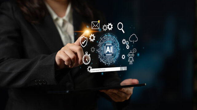Business professional interacting with virtual artificial intelligence symbols on tablet screen in dark office setting showcasing modern technology and innovation. Entropy.
