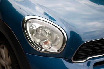Close-up photo of vintage automobile car light front side retro style picture  © Elena K