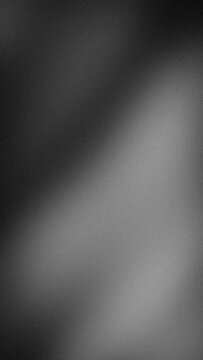Black gray and white vertical grainy abstract background with blurred gradient and grunge texture wallpaper design