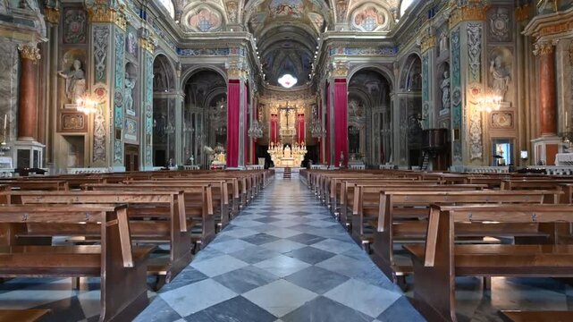 Pietra ligure, liguria, italy. June 24, 2025. Revealing the stunning and ornate interior of the basilica of san nicolo in pietra ligure, italy, pov walking along the central nave