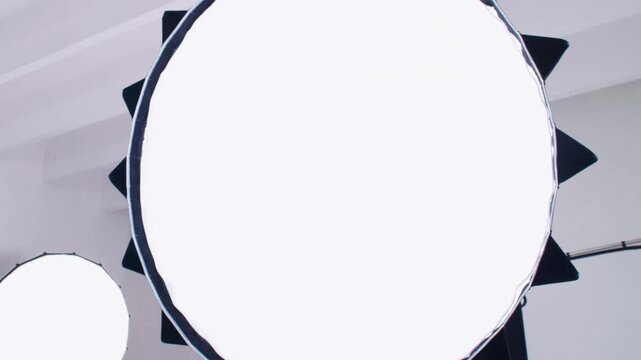 Close-up bright round LED lamp illuminating the photography set