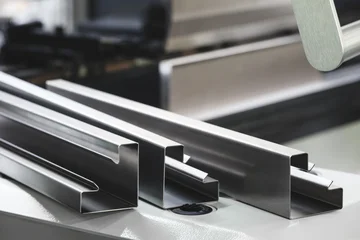 Industrial concept. sheet metal detail manufactured using an industrial bending machine. tech industrial technology background © Aleksandr Matveev