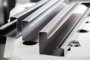 Industrial concept. sheet metal detail manufactured using an industrial bending machine. tech industrial technology background © Aleksandr Matveev