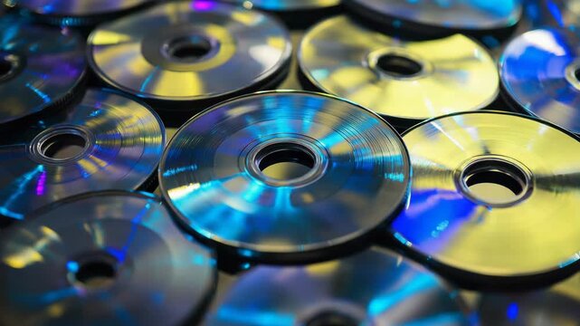 Iridescent compact discs creating a vibrant, abstract background with colorful, holographic light reflections, symbolizing retro digital media, technology, and nostalgia