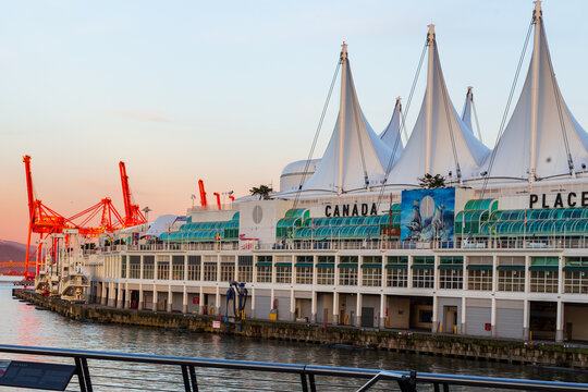 Vancouver, British Columbia, Canada, March 29, 2024- The 1986 Canada Place on Burrard Inlet with its distinctive sail-shaped roofs seen at sunset