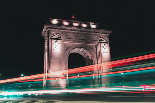 Arch of Triumph in Bucharest at night with long exposure traffic light trails