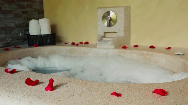 Romantic luxury jacuzzi filling with foam and bubbles