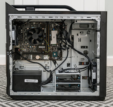 Gothenburg, Sweden - May 24 2026: Open desktop computer case showing motherboard cooling fan and cables.