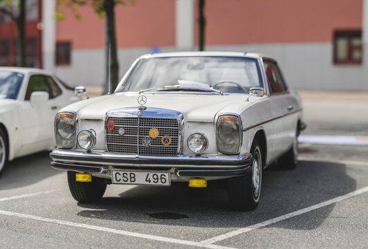 Gothenburg, Sweden - May 30 2026: Classic white Mercedes Benz sedan parked at outdoor automobile gathering.