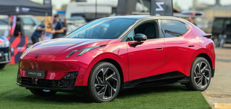 Gothenburg, Sweden - May 30 2026: Red Lynk Co 02 electric crossover displayed outdoors at car event.