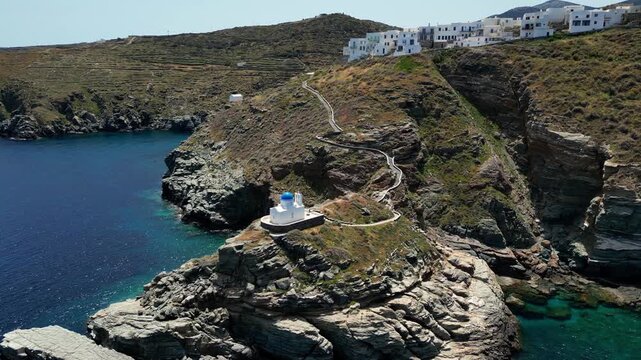 Close to long shot of the Church of the seven Martyrs in Sifnos Greece. Shot on a 4k at 60 fps on a DJI Mini 3 Pro in D-Log Film Colorgraded