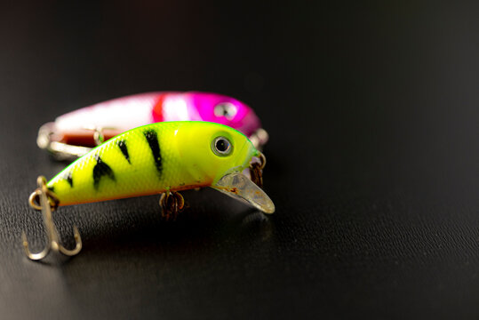 Colorful crankbait fishing lures on dark background The Concept of predator angling
