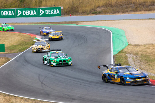 Oschersleben, Germany. 26th July 2026. Arjun Maini heads visible DTM group in blue and yellow number 36 HRT Ford Mustang GT3 Evo through Motorsport Arena Oschersleben. Marco Wittmann follows 