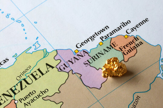Gold Nugget on Map of Suriname Symbolizing Gold Mining and Natural Resources