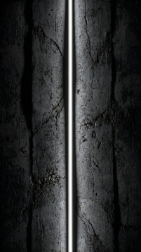 Abstract dark stone texture with a glowing vertical white light line in center