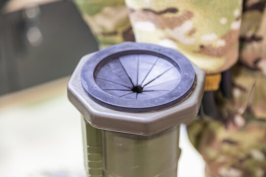 Close-up of a military launch tube protective rubber seal, likely for a man-portable air-defense system MANPADS or anti-tank missile. Depicts infantry weapon design and combat-ready defense gear.
