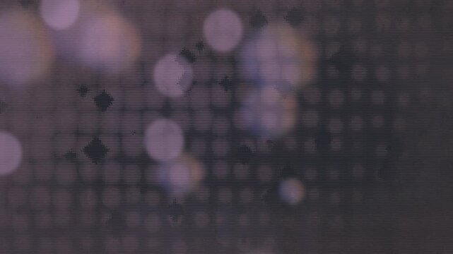 Moody grungy animation with scattered pixelated  diamond and circle shapes in gray and purple tones with a semi symmetrical layout and vintage flicker