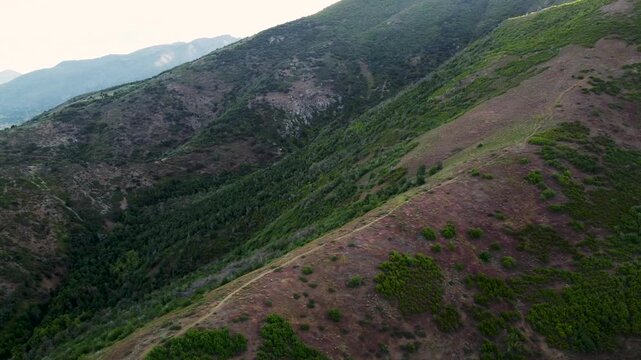 4K Aerial Drone Video Summer Sunrise Over Fernwood Cabin Trail Layton Utah Looking West Across Davis County Valley to Great Salt Lake and Wasatch Mountains
