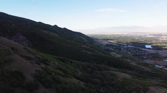 4K Aerial Drone Video Summer Sunrise Over Fernwood Cabin Trail Layton Utah Looking West Across Davis County Valley to Great Salt Lake and Wasatch Mountains