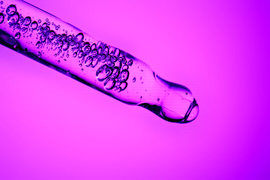 Skincare serum dropper with hyaluronic acid and bubbles