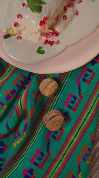 Top view of authentic nuez de castilla and chile en nogada, traditional mexican cuisine