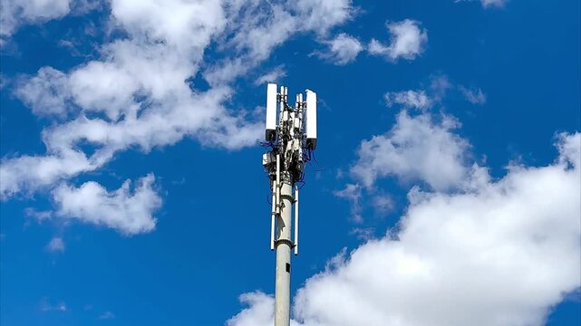 Telscombe, United Kingdom - July 26th 2026: 5G tower with blue sky and clouds background