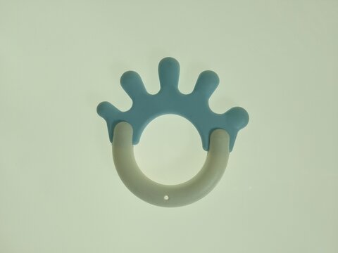 blue crown shaped silicone baby teether with ring handle