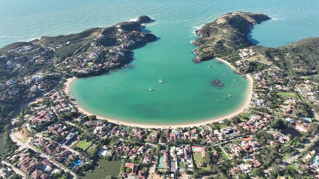 Buzios in Rio de Janeiro. Ferradura beach, Praia da Ferradura. Aerial view, establishing shot.