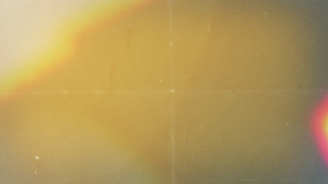 Vintage film light leak texture, retro analog camera burn effect with dust and scratches, warm orange and yellow light overlay for photography