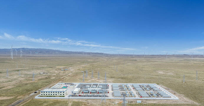 Aerial View of Energy Storage Pwer Station in Arid Grassland with Wind Turbines