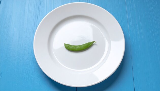 Minimal Food Concept with One Green Bean on White Plate