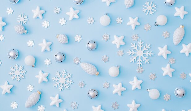 Christmas winter flat lay with silver baubles stars and snowflakes on blue