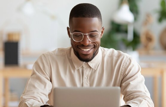 Man professional person typing on laptop as an african business entrepreneur worker