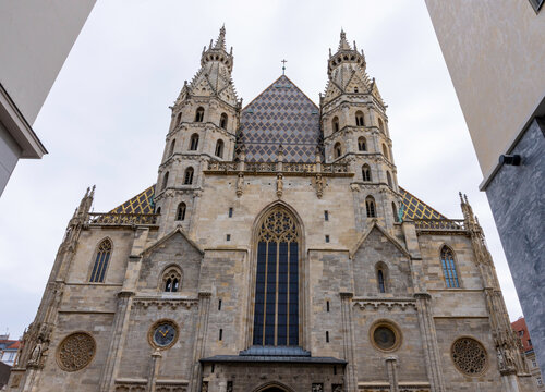 Gothic Cathedral Facade with Twin Towers Framed by Buildings