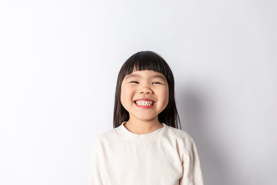 A cute little girl against a white background