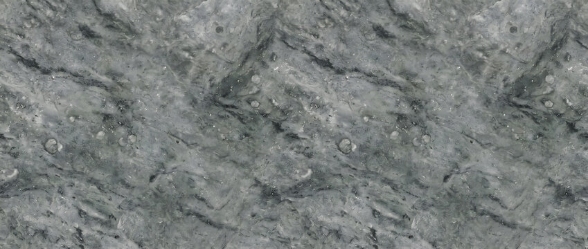 Marble texture displaying a polished dark gray mineral surface with faint cloud patterns provides a luxury natural backdrop for creative design templates