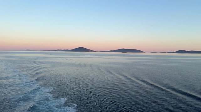 Viewing a Sunrise landscape via boat over the Adriatic Sea and island during late spring season 