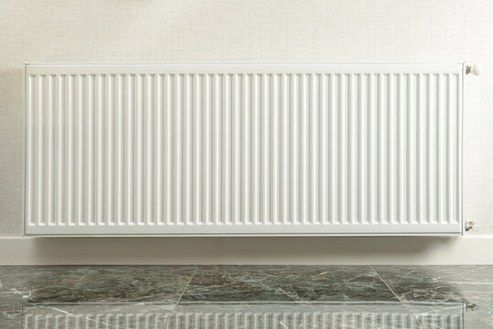Heating season. Radiator heater positioned in cozy interior space. Efficient heating season concept