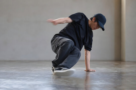 Breakdancer Practicing Handstand Freeze in Studio