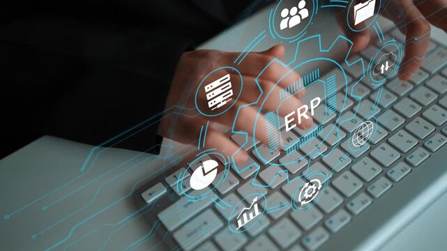 Hands Typing on Keyboard with Digital Icons Representing Enterprise Resource Planning System for Business Management and Technology Integration. Entropy.